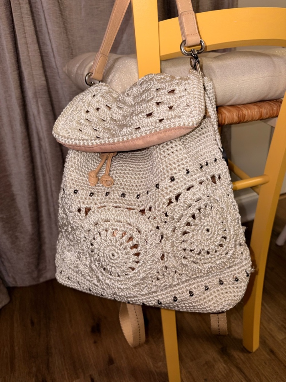 The Sak Cream Crochet Drawstring Backpack with Tan Accents